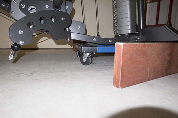 Photograph of Hoist V5 home gym atop furniture dolly, showing protrusion that kept the dolly from being removed.